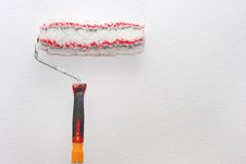Paint Roller On The Wall Royalty Free Stock Photo