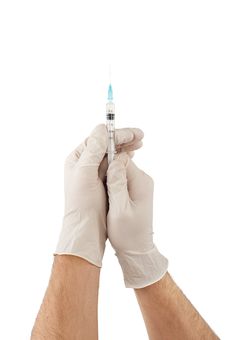 Hands With Gloves Holding Medical Syringe Stock Photo