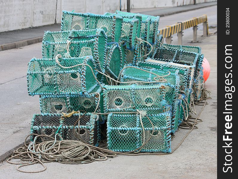 A Pile of Crab Fishing Pots on a Quayside. A Pile of Crab Fishing Pots on a Quayside.
