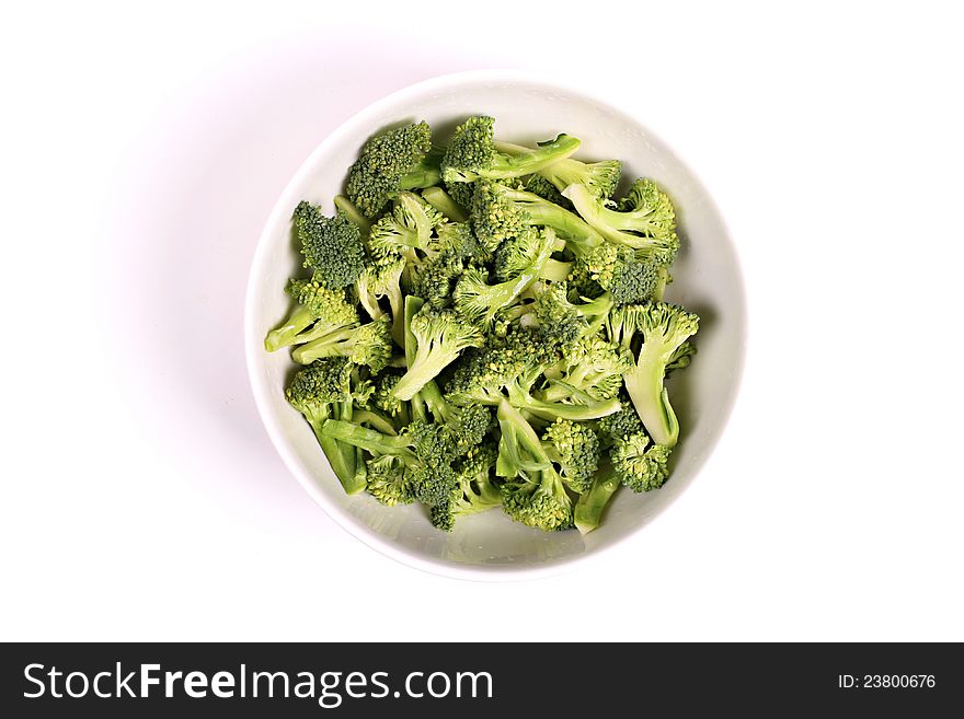 Broccoli in a bowl isolated on white background