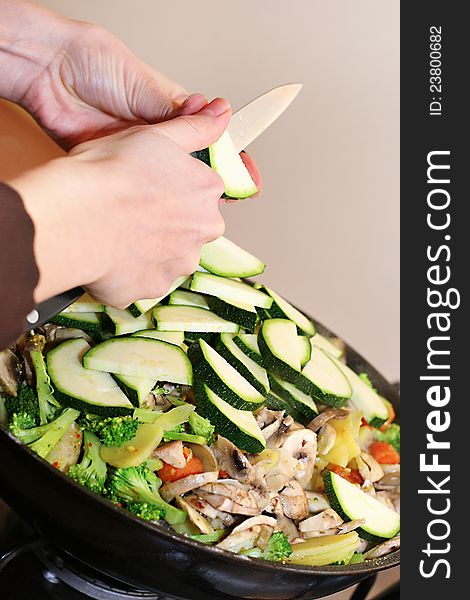 Preparing vegetarian food in wok pan