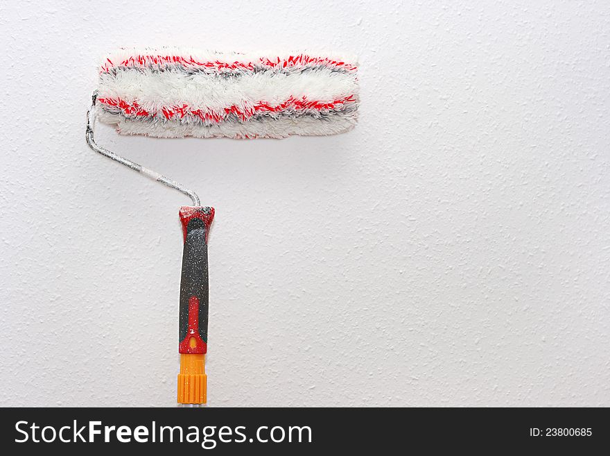 Paint Roller On The Wall
