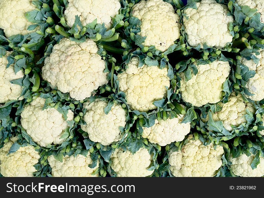 Fresh cauliflower with green leaf