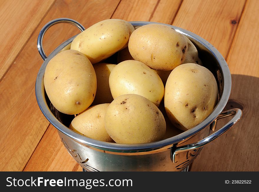Ceasar potatoes in a stainless steel colander, Andalusia, Spain, Western Europe. Ceasar potatoes in a stainless steel colander, Andalusia, Spain, Western Europe.