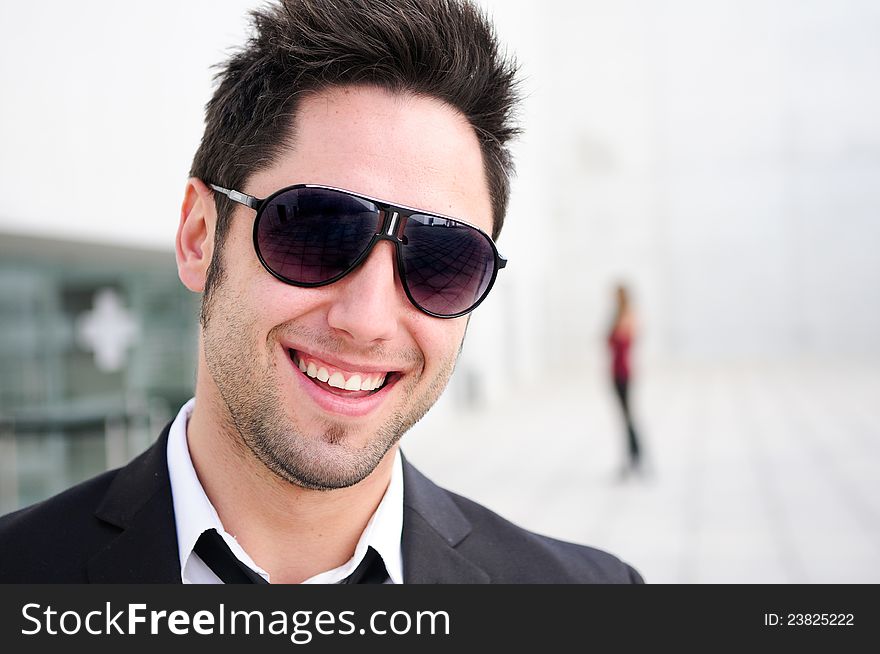 Attractive young businessman laughing