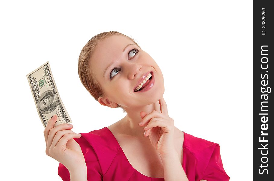 Cheerful dreamy girl in a red blouse holds the money, American dollars isolated on a white background. Cheerful dreamy girl in a red blouse holds the money, American dollars isolated on a white background