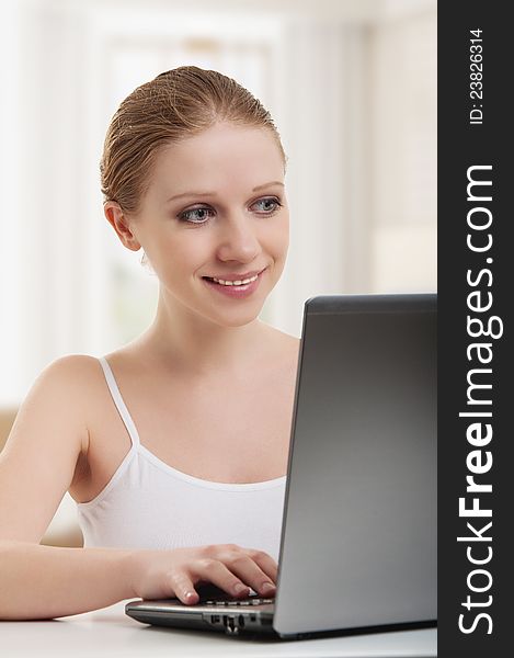 Attractive young woman working for a laptop