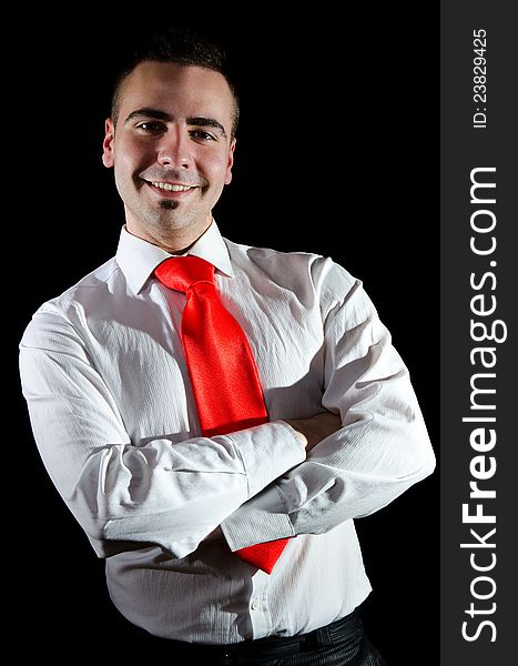 Portrait of smiling young businessman wearing red necktie