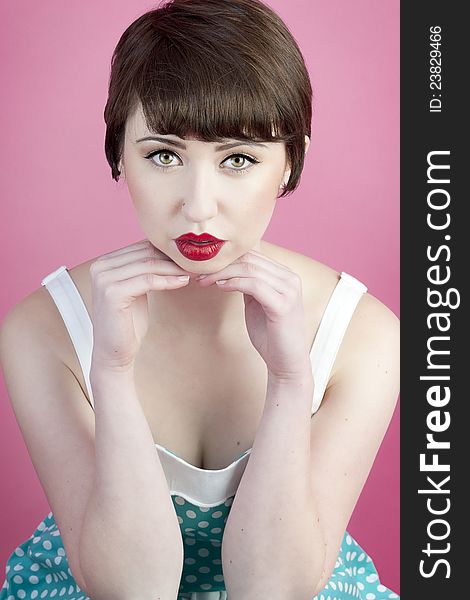 Cute pin up model with full lips and pixie haircut