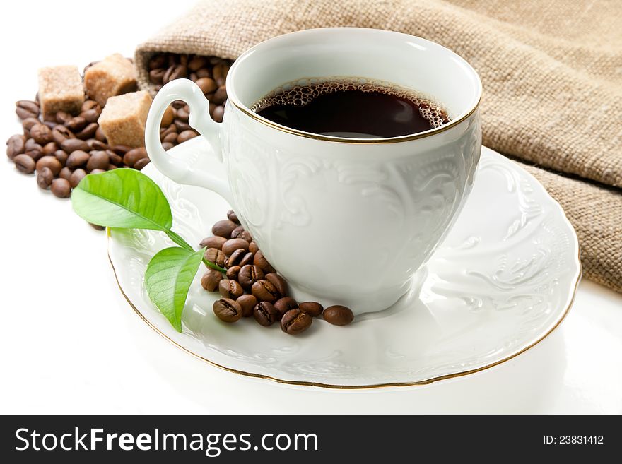 Hot coffee, coffee beans and brown sugar on white background. Hot coffee, coffee beans and brown sugar on white background.