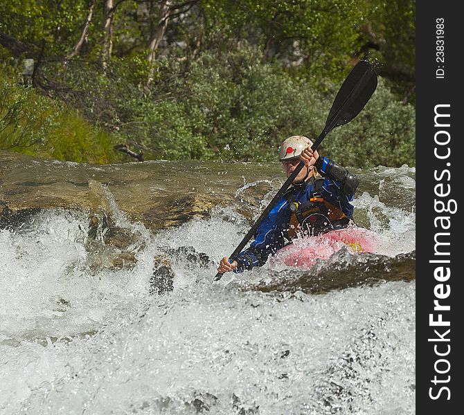 Kayaker in the waterfall