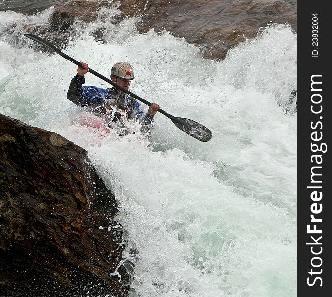 Kayaker in the waterfall