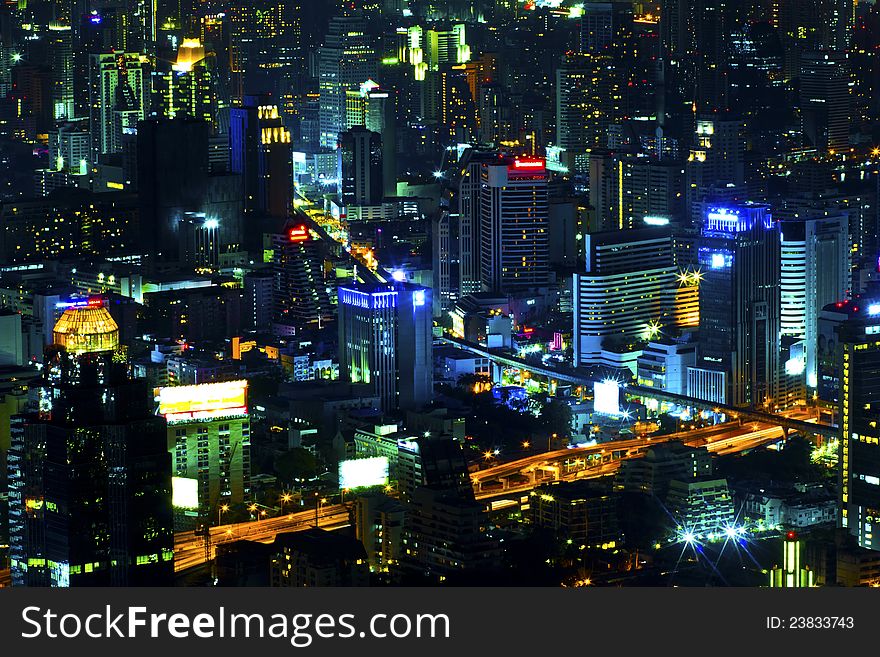 View over the city of bangkok at nighttime with skyscrapers