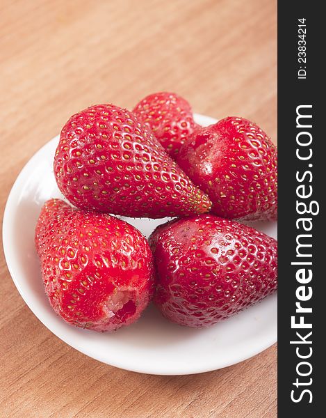 Strawberries  over wood background