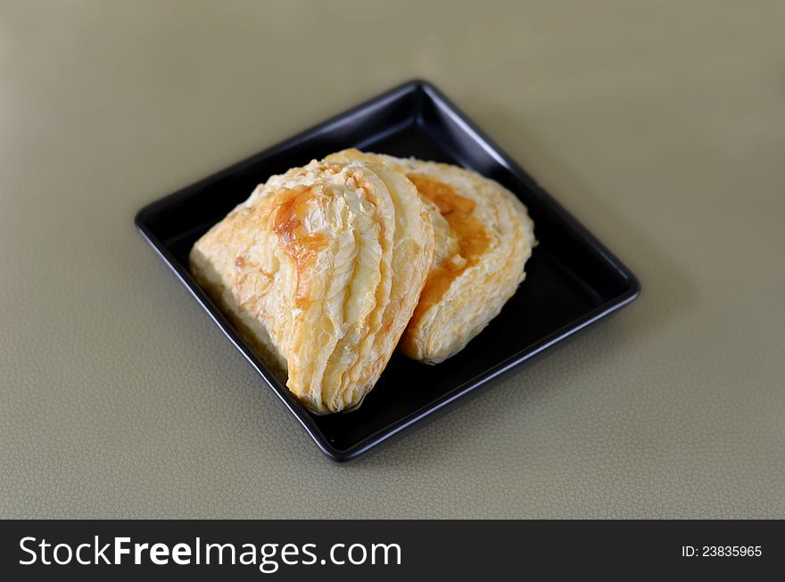 Puff pastry with tuna on the plate. Puff pastry with tuna on the plate