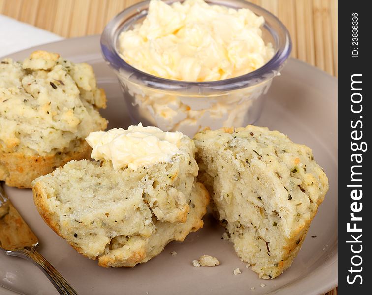 Herb biscuit cut in half with butter. Herb biscuit cut in half with butter