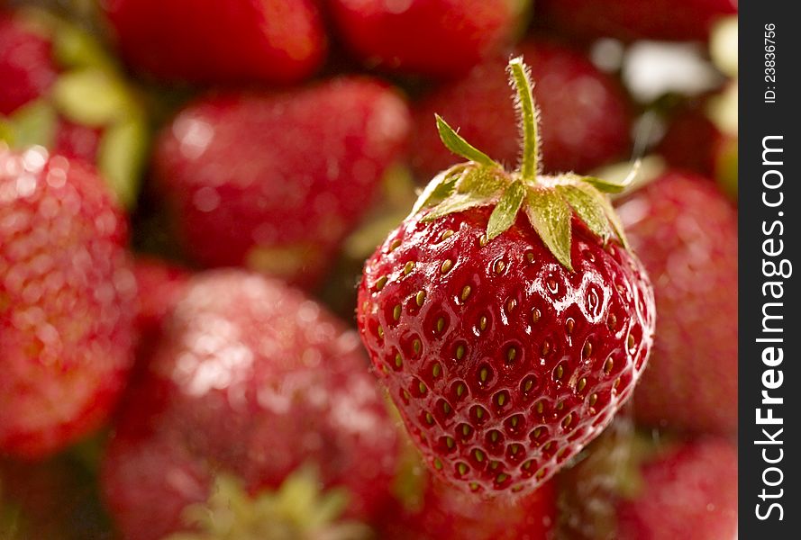 Sweet juicy strawberry over unfocused background