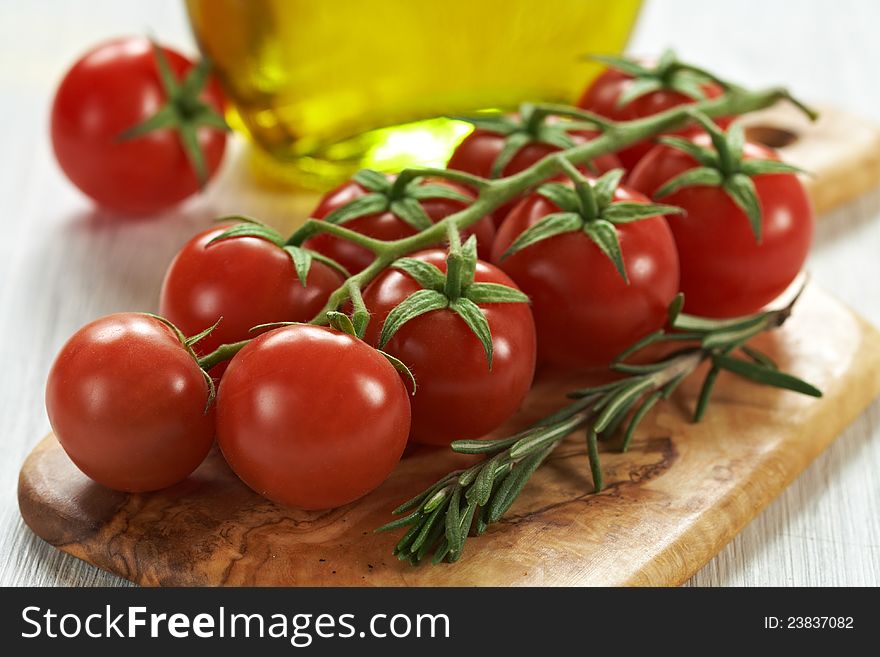Tomatoes, rosemary and olive oil. Tomatoes, rosemary and olive oil