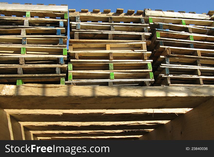 Piles of industrial wooden pallets. Piles of industrial wooden pallets