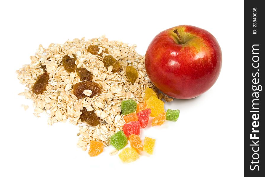Grits, candied fruit and apple on a white background