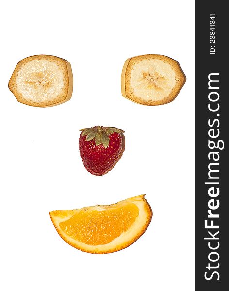 Fruit smiling face with strawberry banana and orange