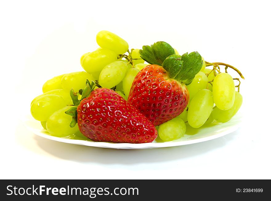 Grapes with strawberry on a white background