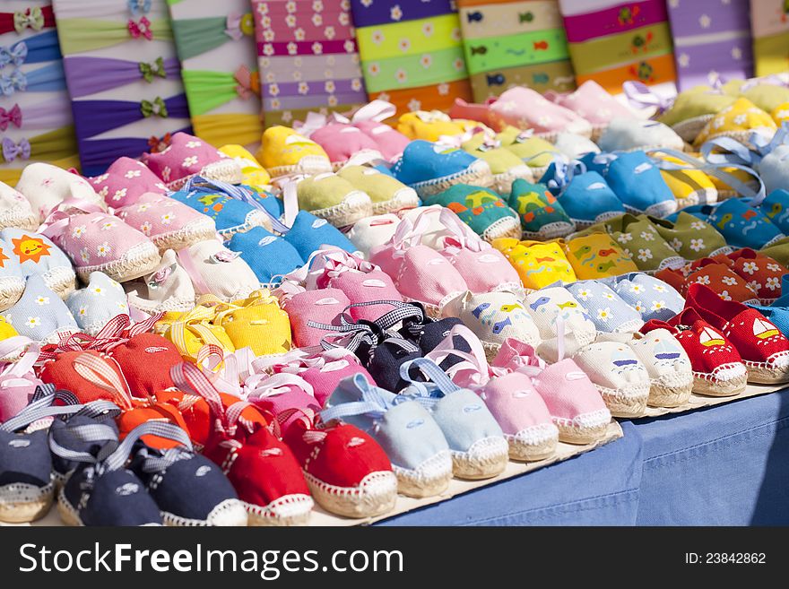 Small cloth sandals in various colors for babies. Small cloth sandals in various colors for babies