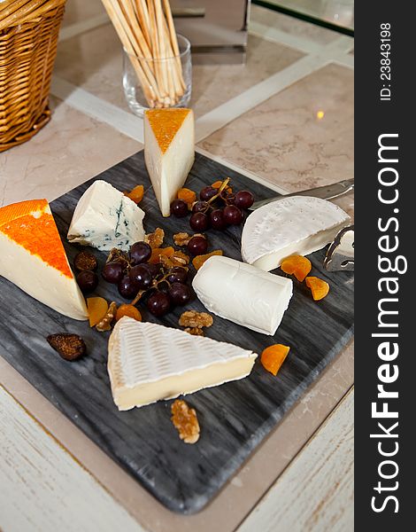Big group of cheeses with redgrapes. Big group of cheeses with redgrapes