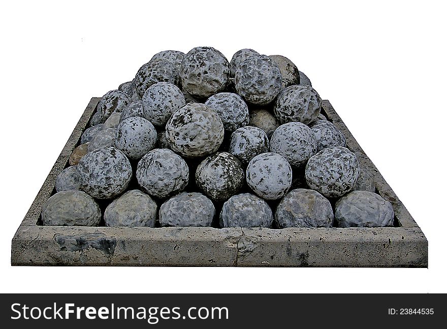 Antique cannon stone bullets pile
