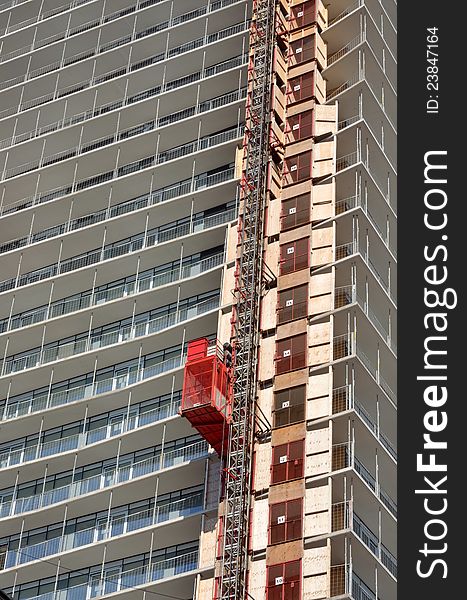 Medium shot of condominium tower under construction. Medium shot of condominium tower under construction