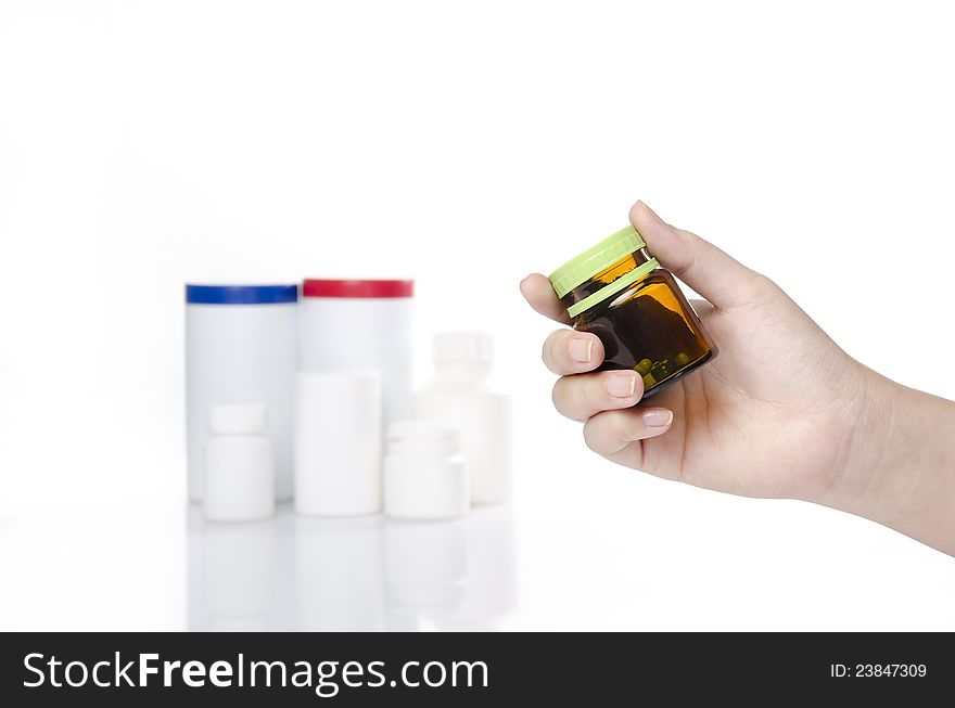 Woman hand holding a bottle of medicine. Woman hand holding a bottle of medicine