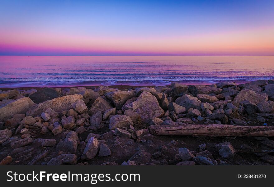 Purple Water Amongst The Rocks