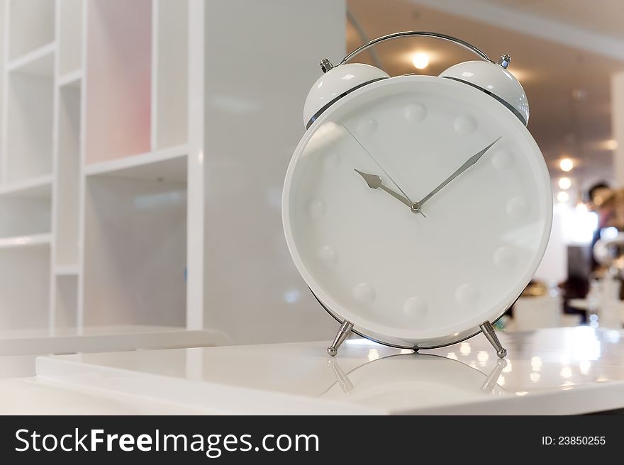 Photos of beautiful white classic alarm clock. Photos of beautiful white classic alarm clock