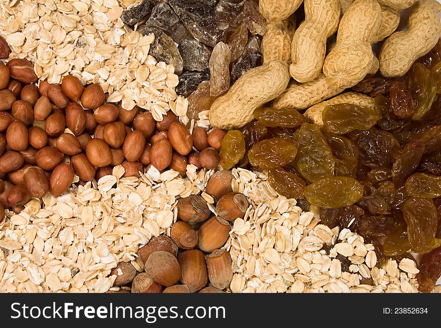 Background of nuts , raisins , oatmeal , brown sugar. Background of nuts , raisins , oatmeal , brown sugar