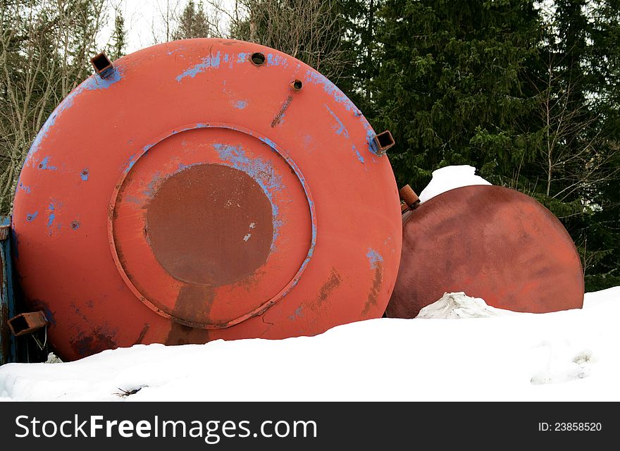 Rusty old industrial drums dumped in a forest. Rusty old industrial drums dumped in a forest