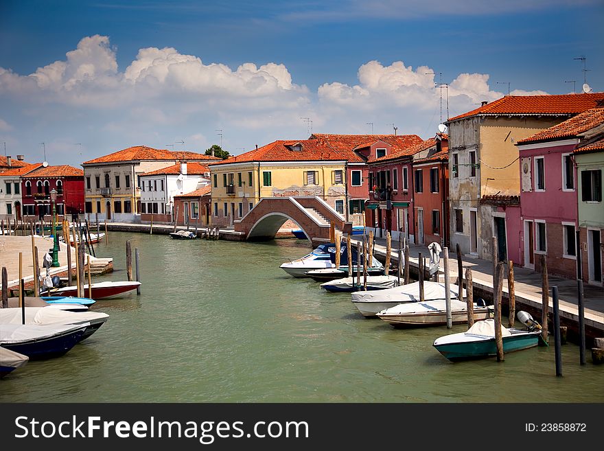 Canal with colorful houses / Italy / nobody