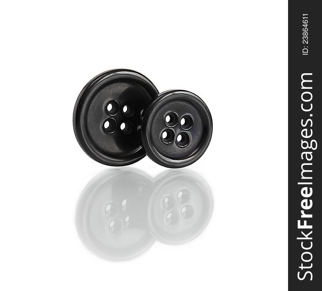 Two black buttons standing on white background.  with clipping path. Two black buttons standing on white background.  with clipping path