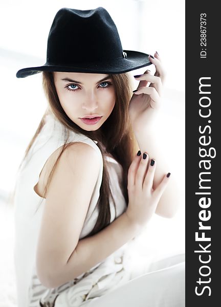 Vintage - pretty girl in black hat closeup