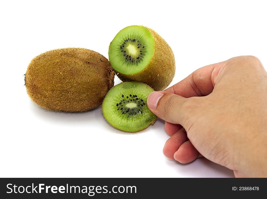 Pieces of kiwi whit hand isolated on white background.