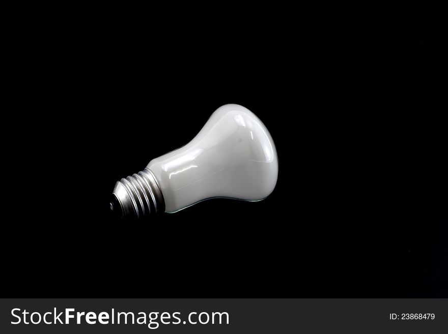 White lamp isolated on a black background.