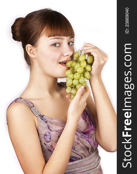 Red pretty woman eating grapes over white background. Red pretty woman eating grapes over white background