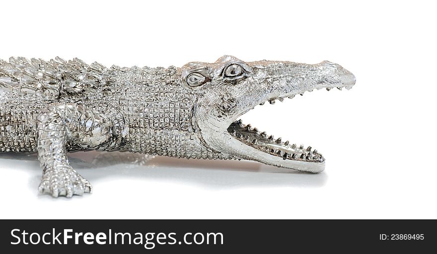 Photos of decorative figurines crocodile on a white background. Photos of decorative figurines crocodile on a white background