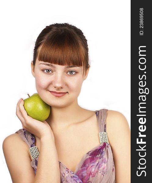 Young happy woman holding an apple on white background