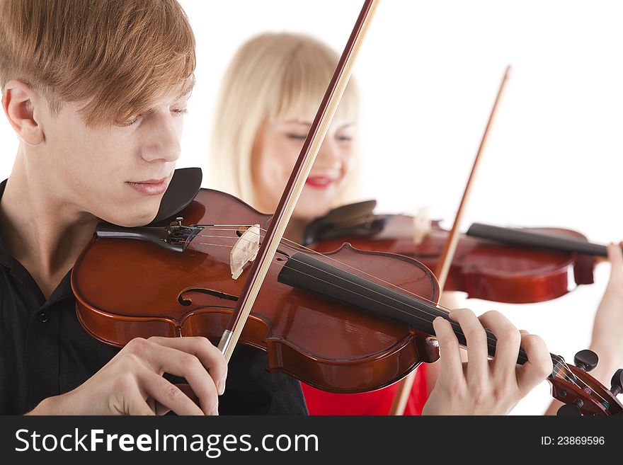 Image of musicians playing violins on white