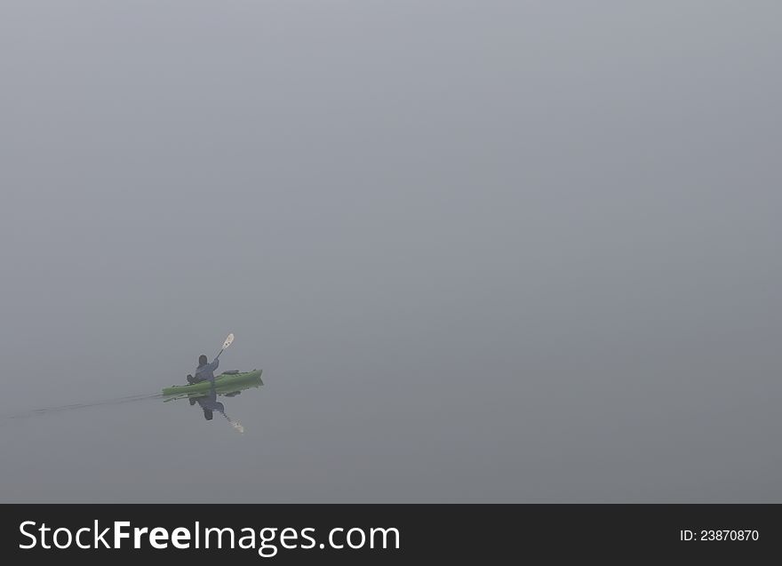 Kayak on a foggy lake