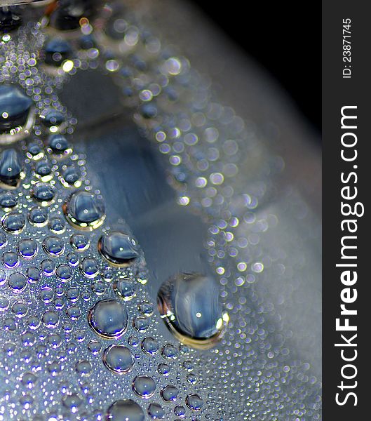 A closed image of water condensation inside a bottle after it has been exposed for days in the room temperature. A closed image of water condensation inside a bottle after it has been exposed for days in the room temperature.