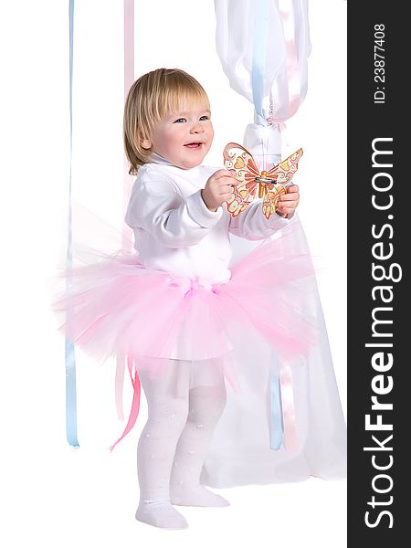 Happy laughing young girl in a pink tutu with butterfly