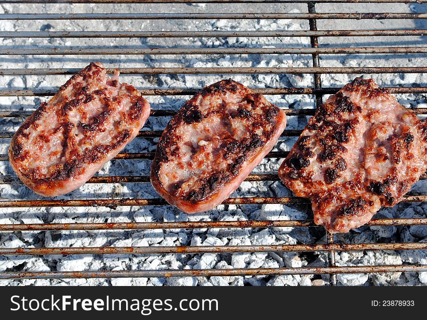 Grilled pork sausage on a barbecue