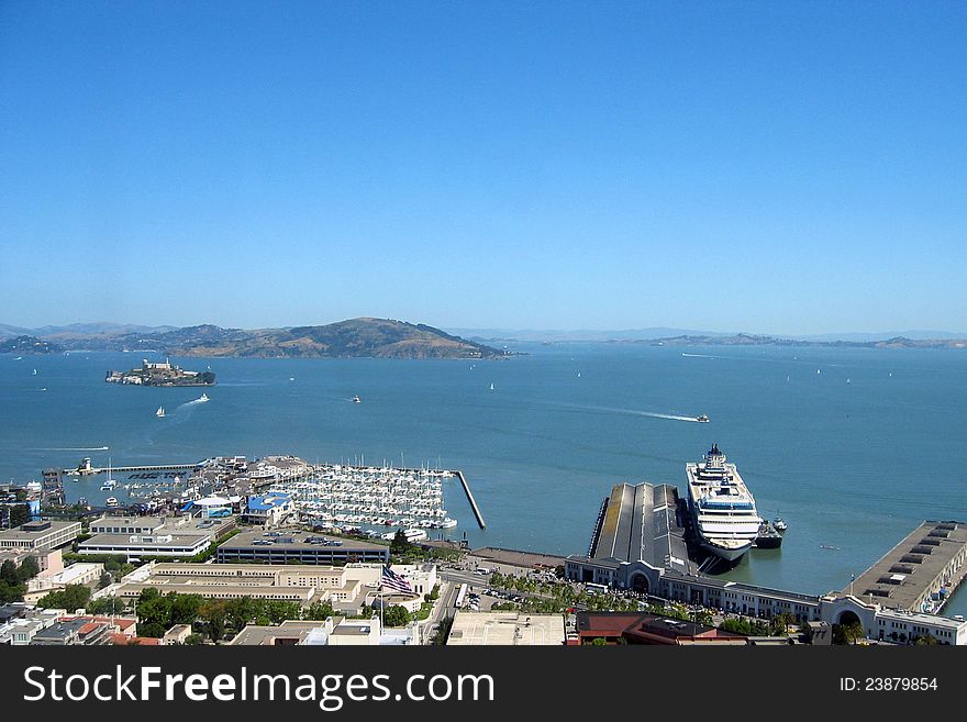 Cruise ship at pier in San Francisco, with Alcatraz in the distance. Cruise ship at pier in San Francisco, with Alcatraz in the distance.