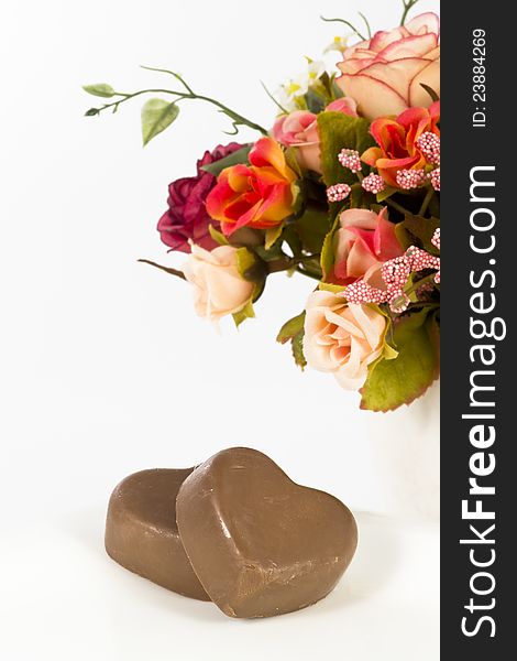 Chocolate heart and rose in the Valentine's Day, white background. Chocolate heart and rose in the Valentine's Day, white background